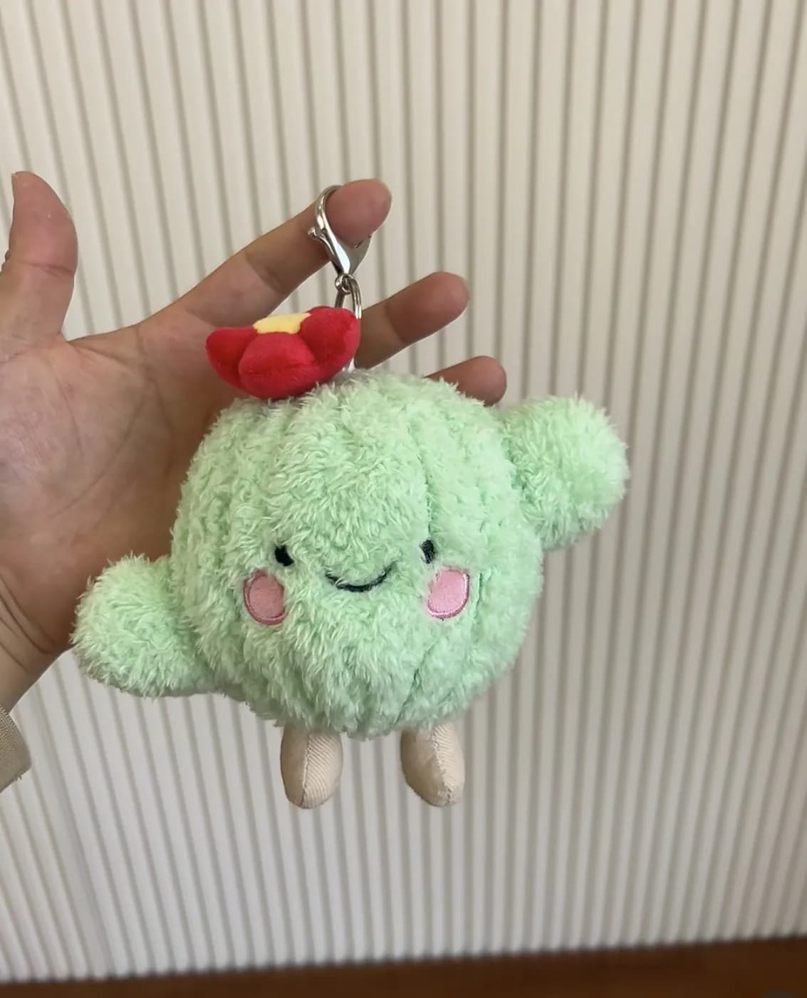 Mint green cloud plush charm with embroidered blush cheeks