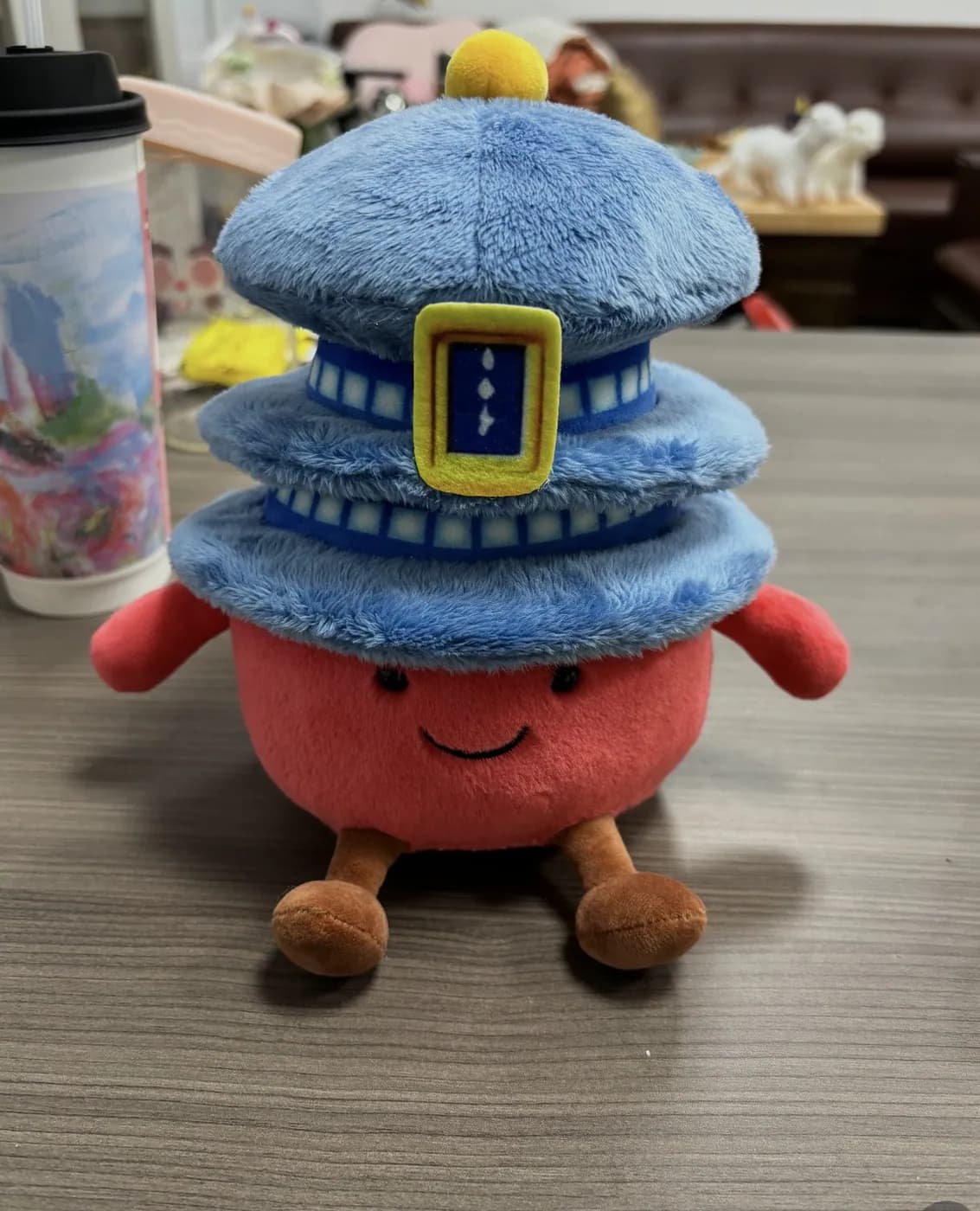 Blue tiered pagoda plush on a red character body